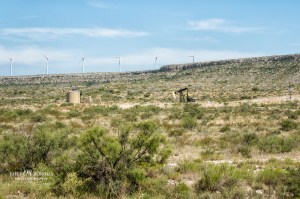 Oil derrick and wind farm in Texas’ Permian Basin